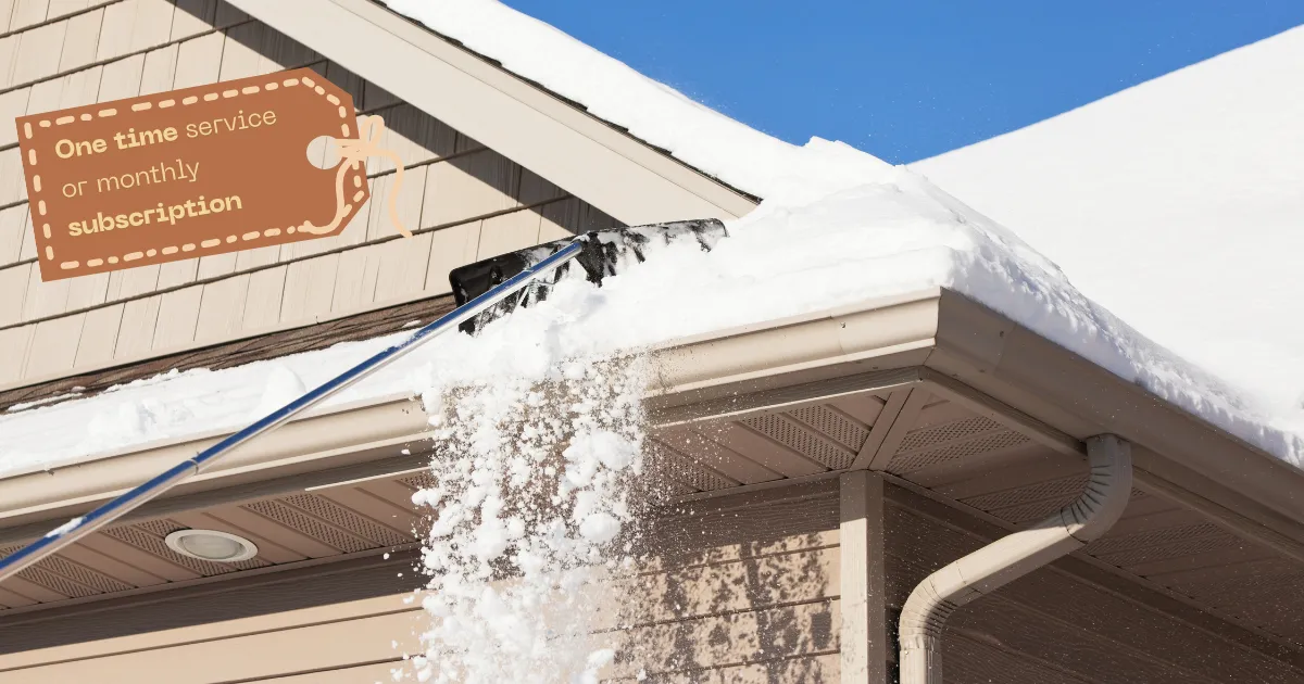 Roof snow removal in Fish Haven, Idaho, featuring a snow shovel clearing snow from a roof edge, with a tag highlighting one-time service or monthly subscription options.